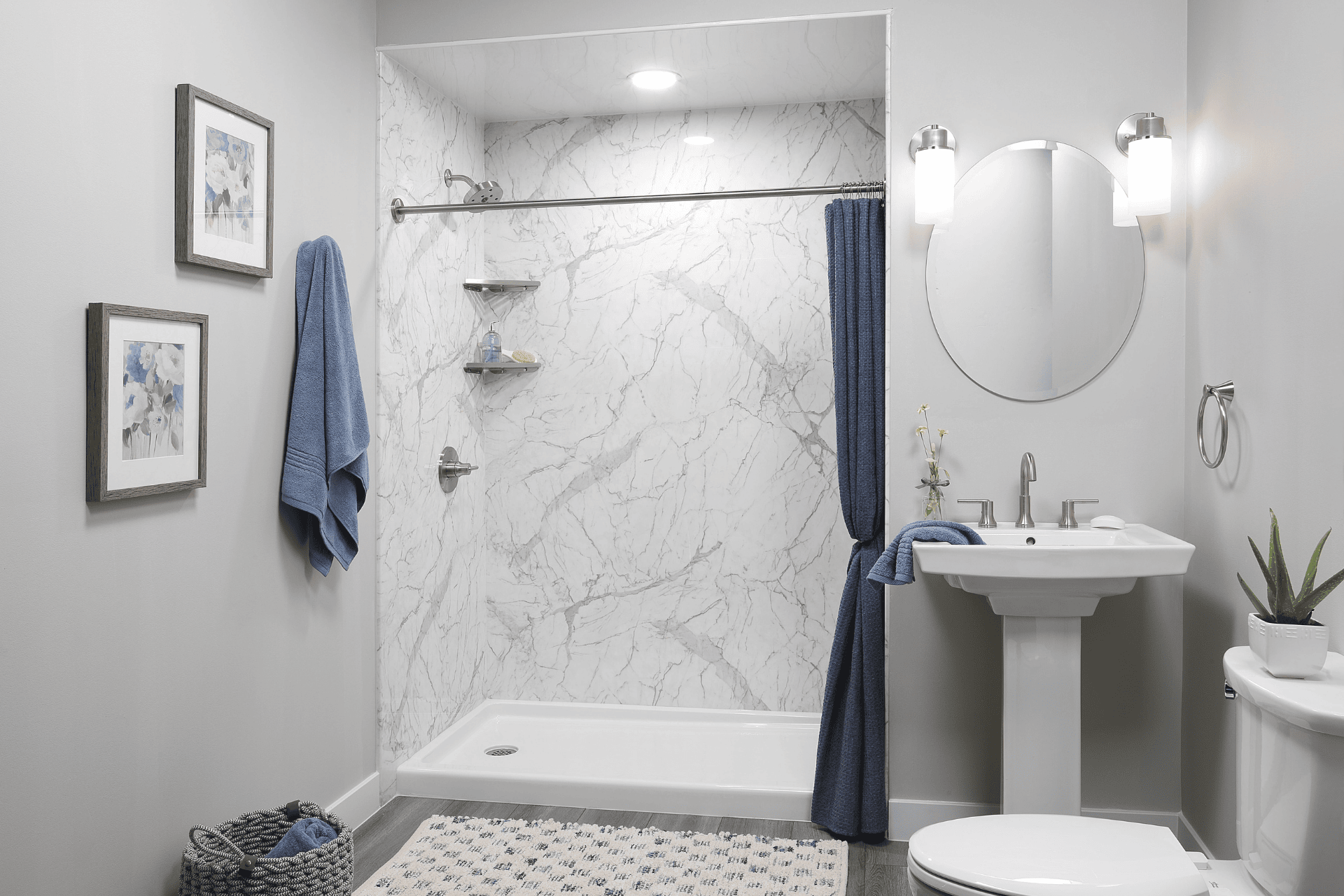 Walk-in shower with acrylic wall in Santorini White.