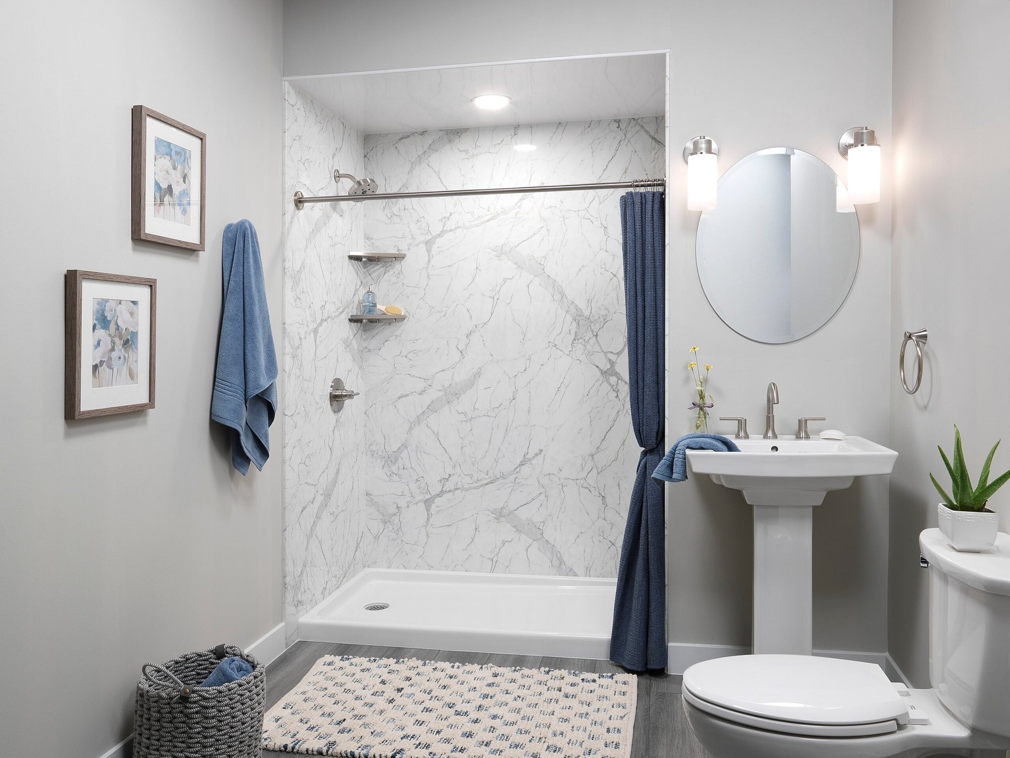 Photo of a spacious walk in shower with faux marble acrylic wall panels and a shower curtain. Mid-range walk in shower remodel