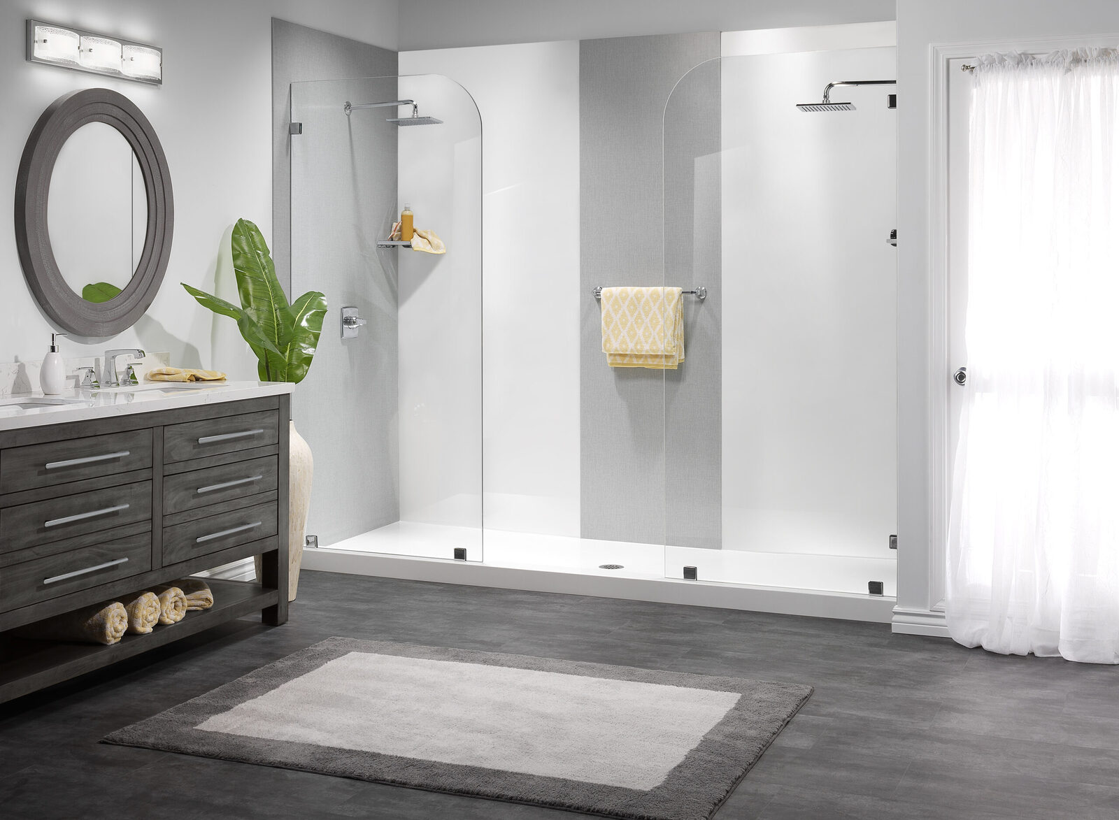 Photo of a spacious two-person walk in shower with glass enclosures and dual shower heads