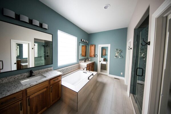Photo of a bathroom with a stand alone bathroom that takes up too much space and should be converted to a shower