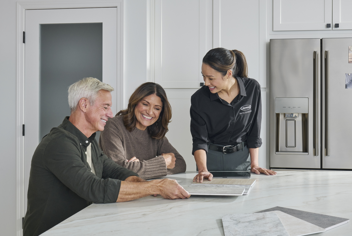 Photo of an in-home consultation with a couple before a shower remodel