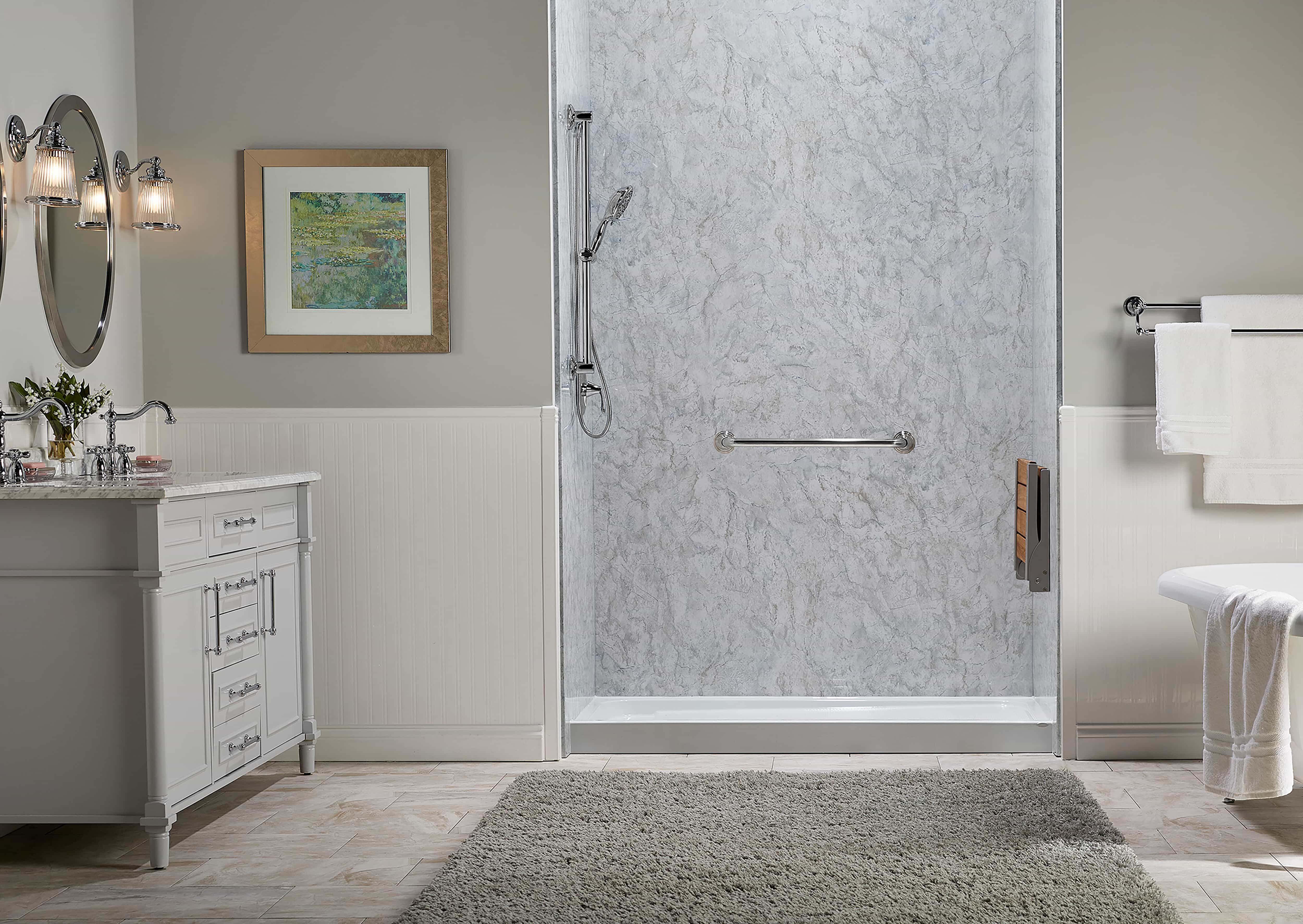 Walk-in shower with grab bar and foldable seating with Champagne Travertine walls