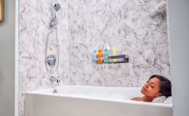 Photo of a woman relaxing in a Jacuzzi tub (tub and shower combo) with Midnight Storm walls