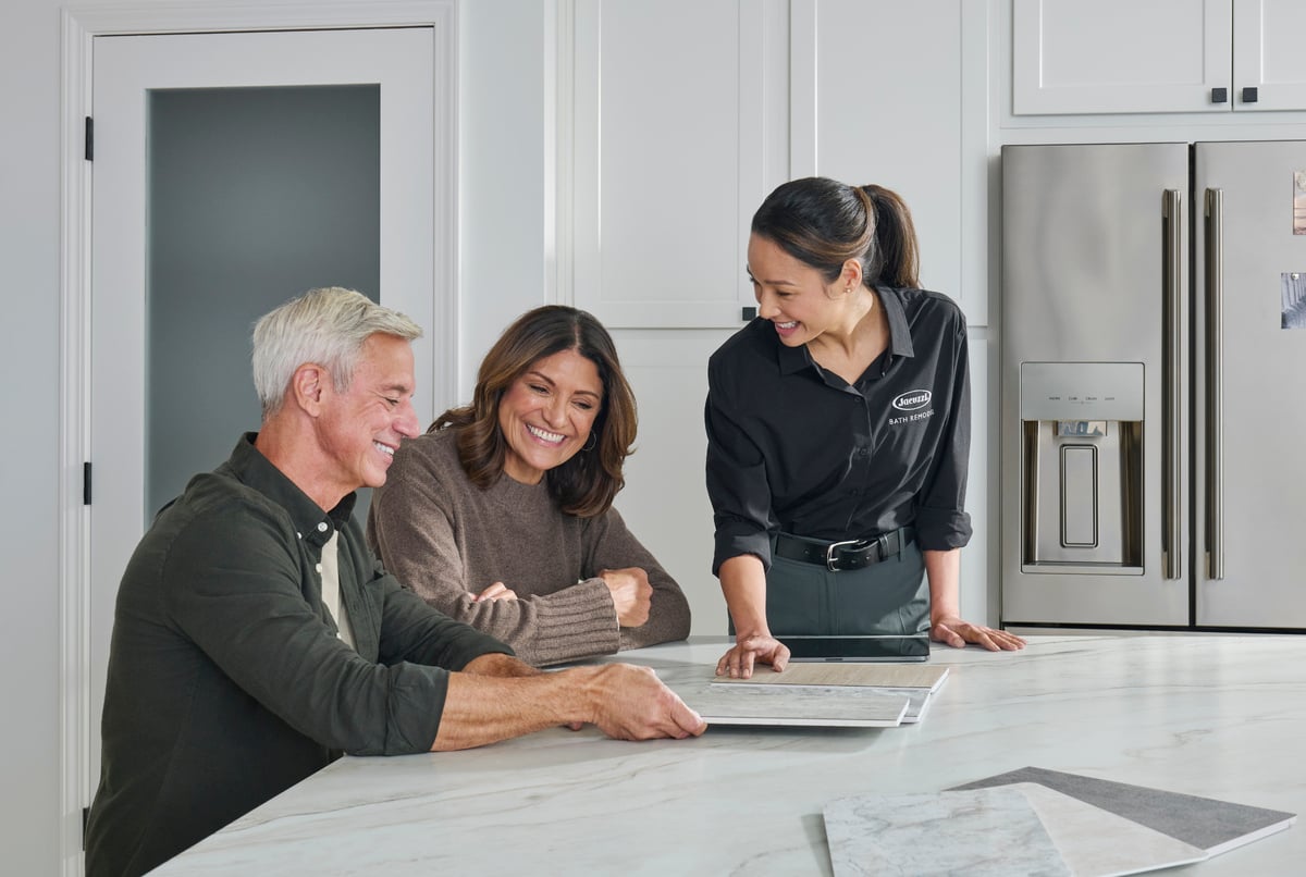 Photo of an in-home consultation with a couple before a shower remodel