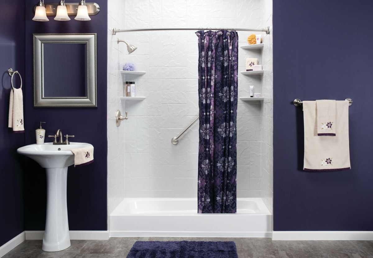 Simulated stone in a Jacuzzi walk in shower with a deep threshold