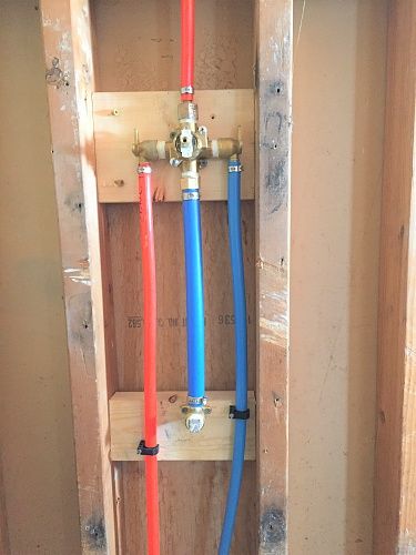 Photo of a PEX system for the hot and cold water in a new shower