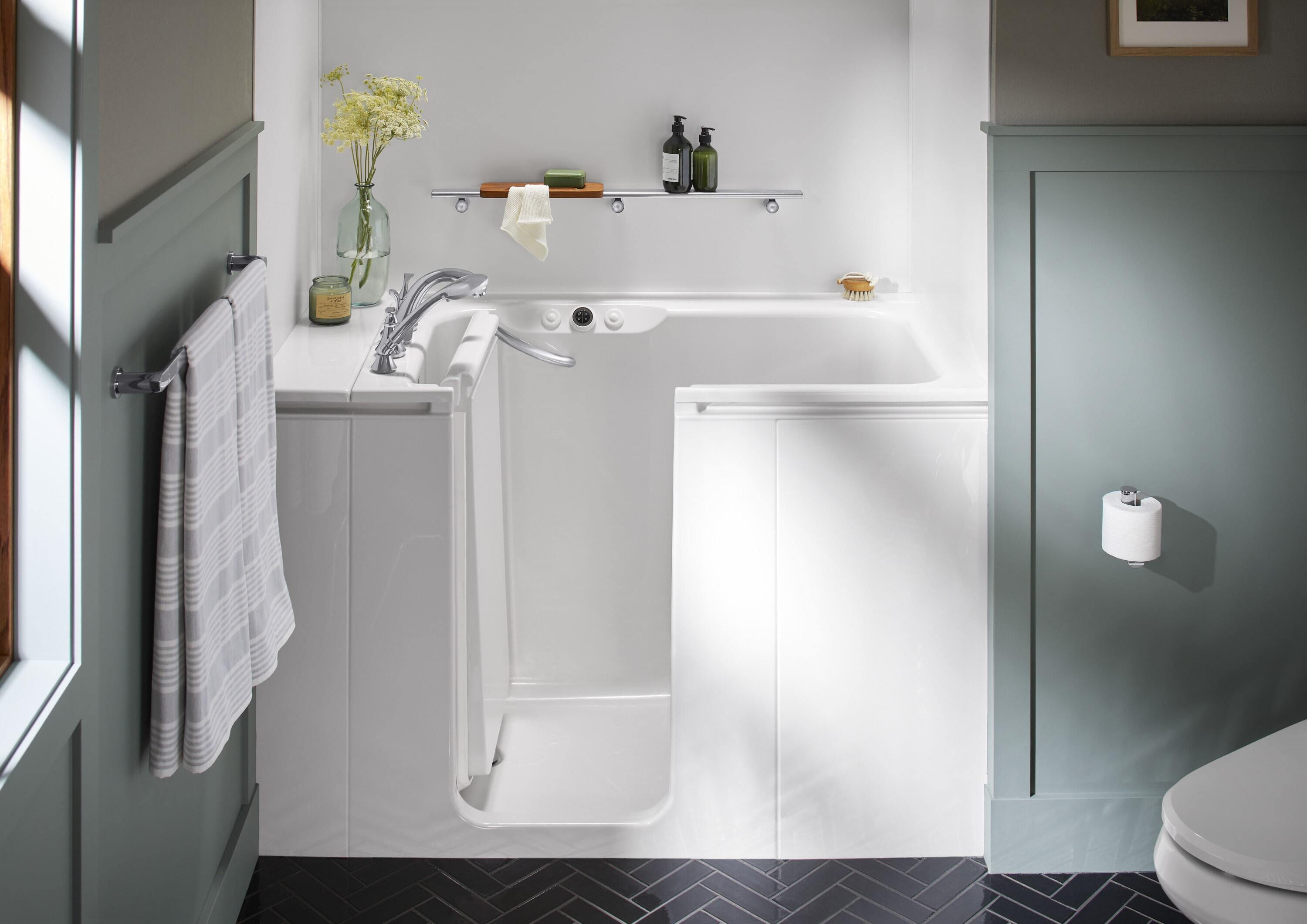 KOHLER White walk-in bathtub with chrome fixtures