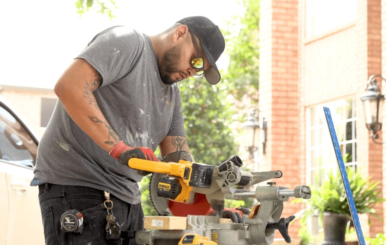 Screenshot of a Zintex installer cutting wood before a shower install