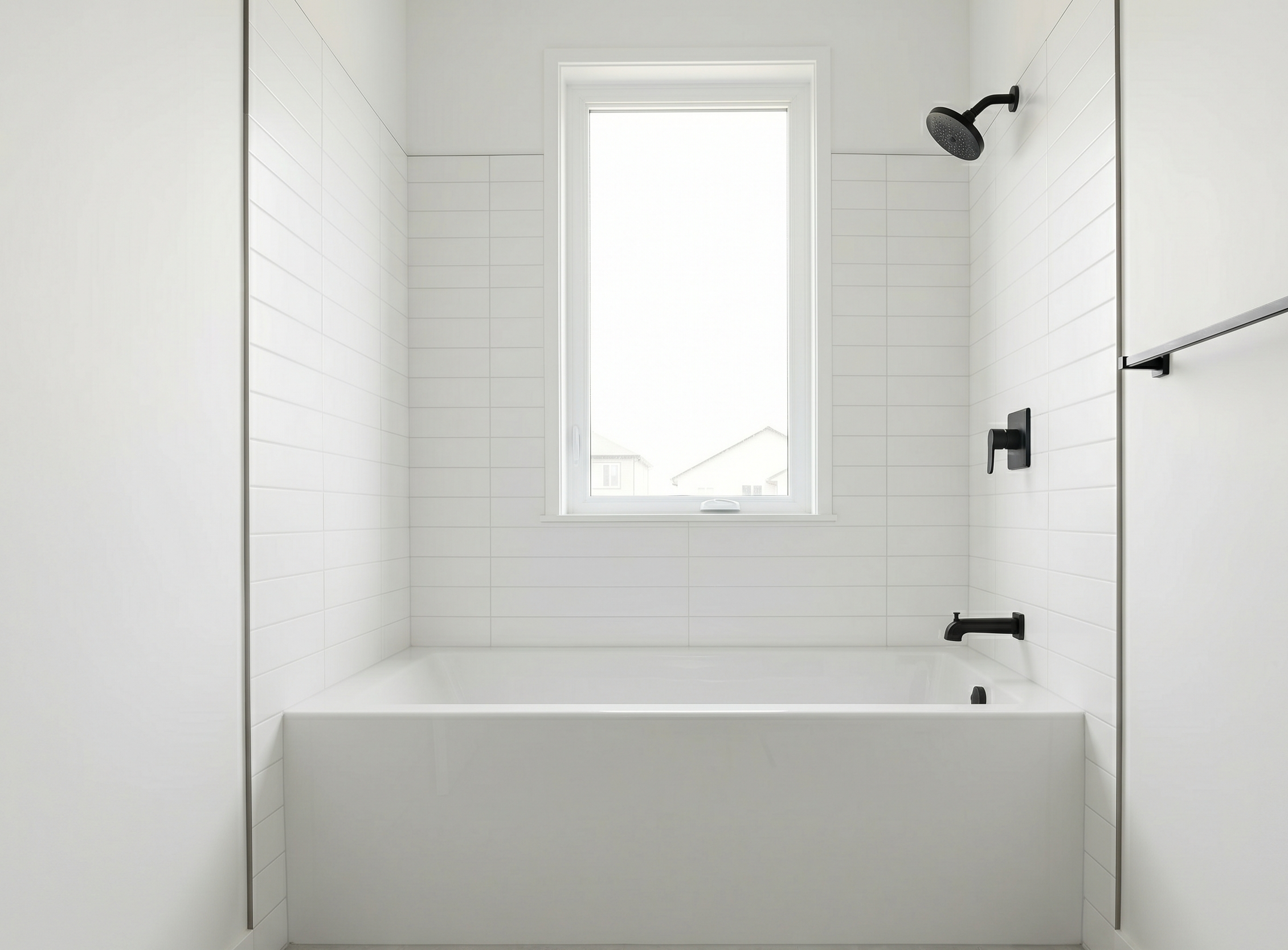 Matte black bathroom fixtures with white tub